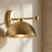Eloria sconce brass detail on plaster