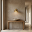 Eloria sconce in a limestone hallway