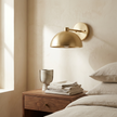 Eloria sconce above a walnut nightstand