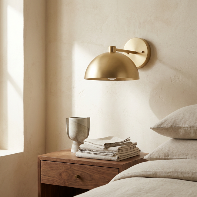 Eloria sconce above a walnut nightstand