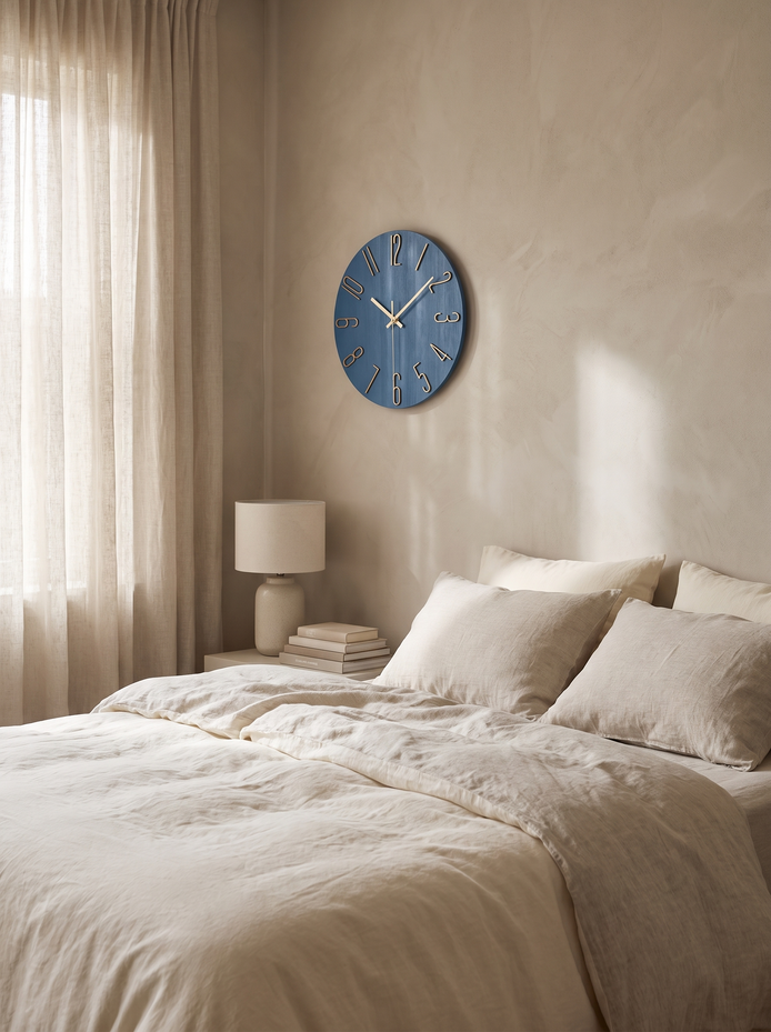 Noble Modern Wall Clock above a linen bed in a calm bedroom