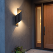 Spiral Outdoor LED Wall Light mounted beside a front door